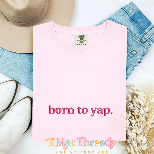 Embroidered “born to yap.”